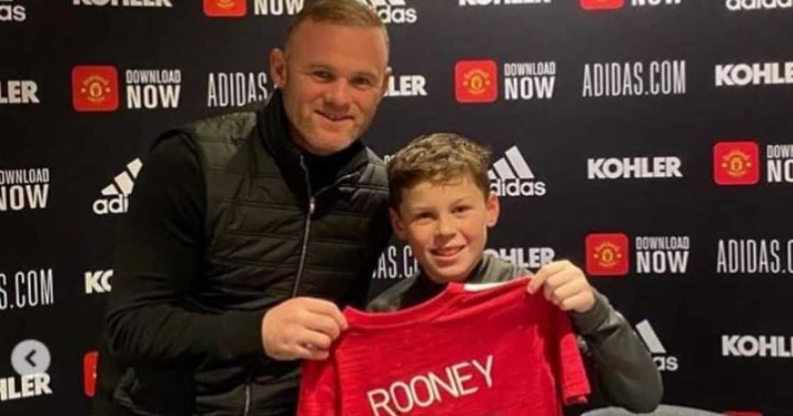 Wayne Rooney's son Kai poses with a Man United jersey after joining the club. Photo: Instagram/Wayne Rooney. Wayne Rooney's son Kai poses with a Man United jersey after joining the club. Photo: Instagram/Wayne Rooney.