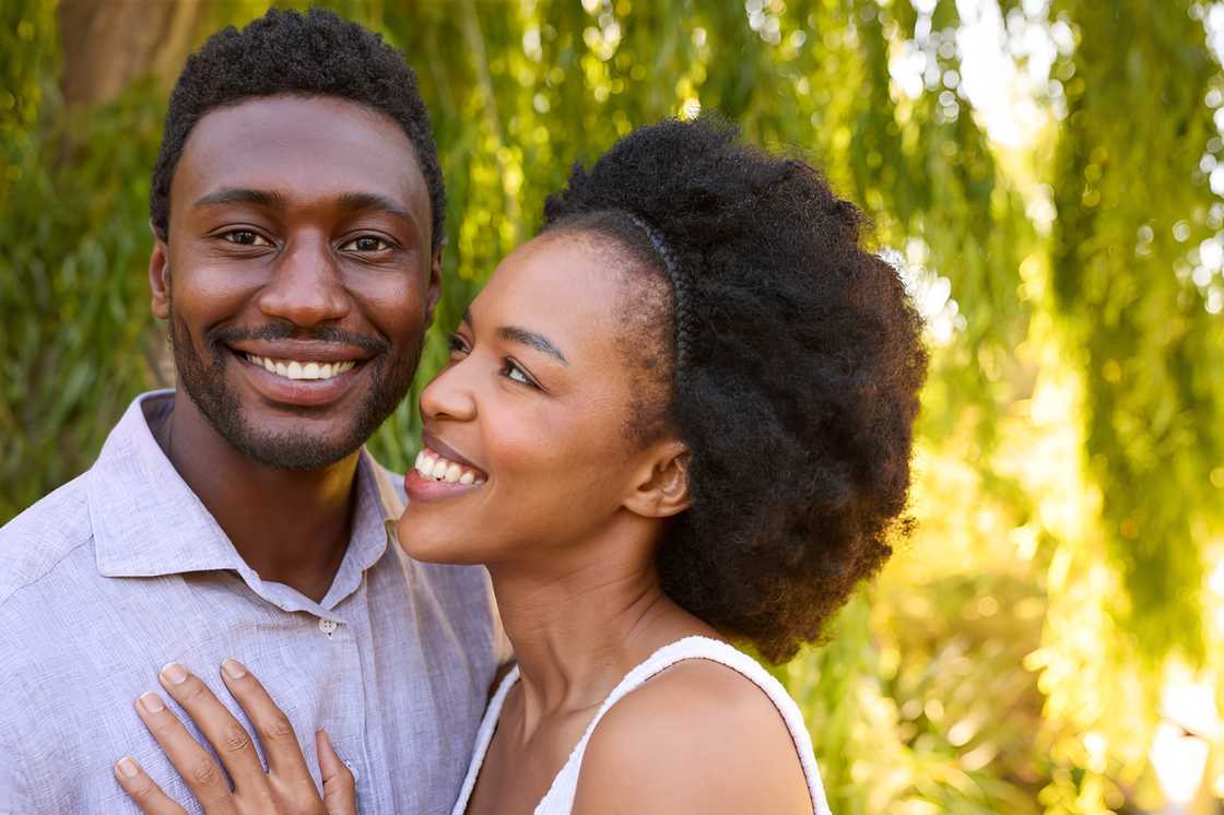 Portrait of a loving couple outdoors, hugging