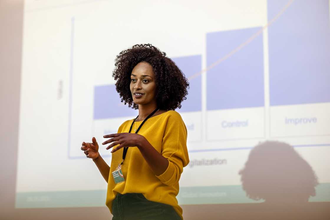 A student giving her presentation before a class.