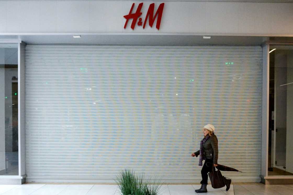 A woman walks past a closed H&M clothing store at a shopping mall in Moscow in March 2022: Yale University business experts say Western sanctions are taking a serious toll on the Russian economy after its invasion of Ukraine A woman walks past a closed H&M clothing store at a shopping mall in Moscow in March 2022: Yale University business experts say Western sanctions are taking a serious toll on the Russian economy after its invasion of Ukraine
