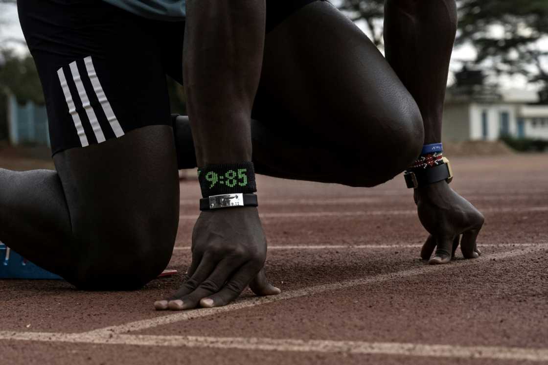 Omanyala wears wristbands bearing his fastest times