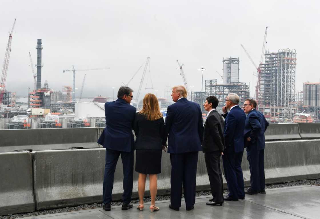 Big Oil tends to back Donald Trump -- here, the Republican then president (C) visited a Shell petrochemical plant in Monaca, Pennsylvania in 2019 Big Oil tends to back Donald Trump -- here, the Republican then president (C) visited a Shell petrochemical plant in Monaca, Pennsylvania in 2019