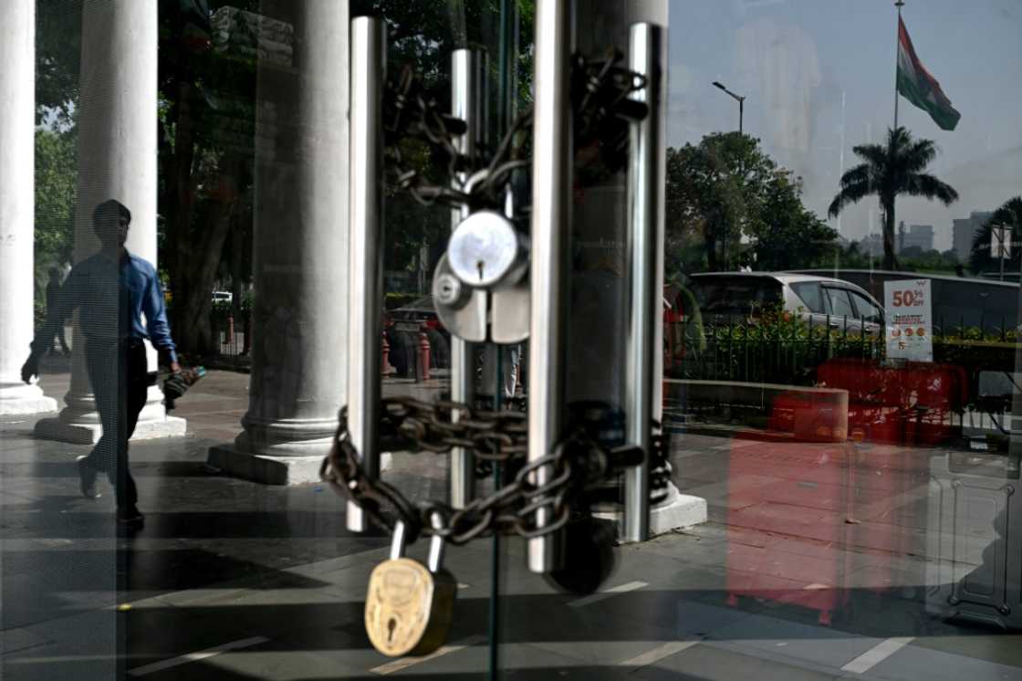 A man walks past a closed shop during a shutdown called by different trade unions to show solidarity with victims of the Pahalgam tourist attack, in New Delhi on April 25 A man walks past a closed shop during a shutdown called by different trade unions to show solidarity with victims of the Pahalgam tourist attack, in New Delhi on April 25