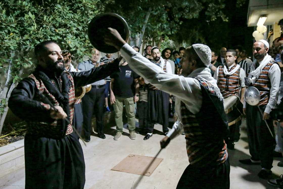 Syrian "Arada" folklore dancers of the "Bab al-Hara" troupe perform while in traditional dress Syrian "Arada" folklore dancers of the "Bab al-Hara" troupe perform while in traditional dress