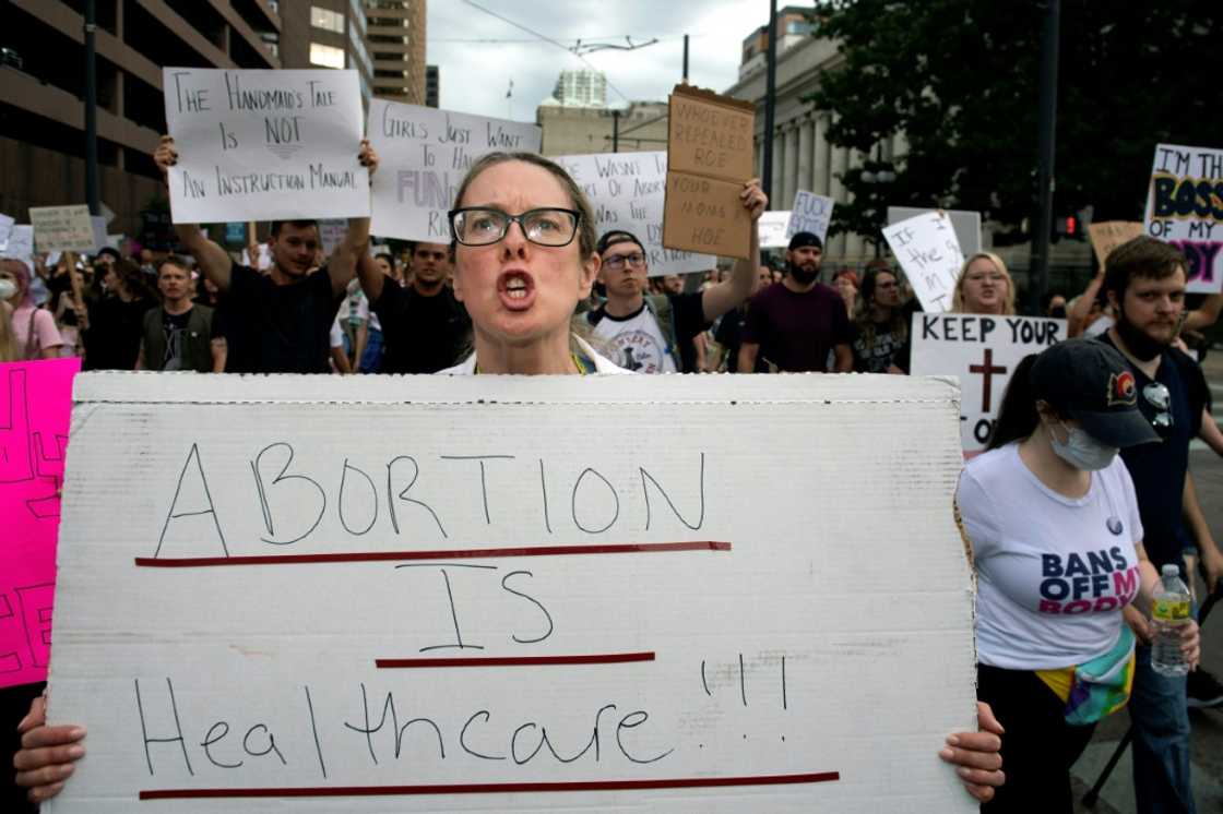 Kara Beasley, a doctor, protests the overturning of Roe v Wade in Denver -- doctors are also worried that patient care could suffer if physicians are worried about their legal situation Kara Beasley, a doctor, protests the overturning of Roe v Wade in Denver -- doctors are also worried that patient care could suffer if physicians are worried about their legal situation