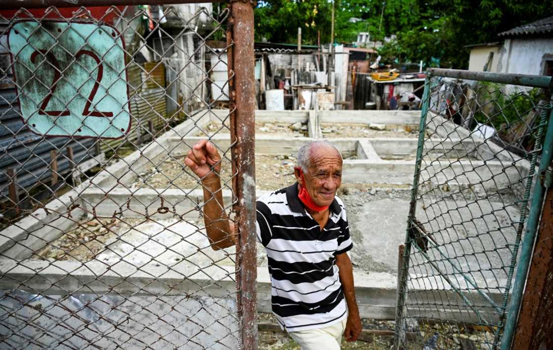 Jorge Gil, a representative of the Communist Party of Cuba, stands in front of the foundation of his house which was demolished as part of a neighborhood improvement program but never rebuilt Jorge Gil, a representative of the Communist Party of Cuba, stands in front of the foundation of his house which was demolished as part of a neighborhood improvement program but never rebuilt