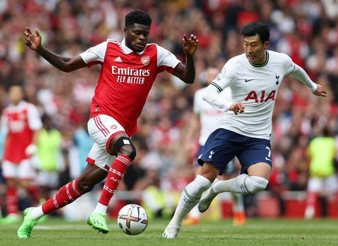 Arsenal midfielder Thomas Partey (L) attacks against Tottenham Hotspur in an English Premier League match on October 1, 2022. Arsenal midfielder Thomas Partey (L) attacks against Tottenham Hotspur in an English Premier League match on October 1, 2022.