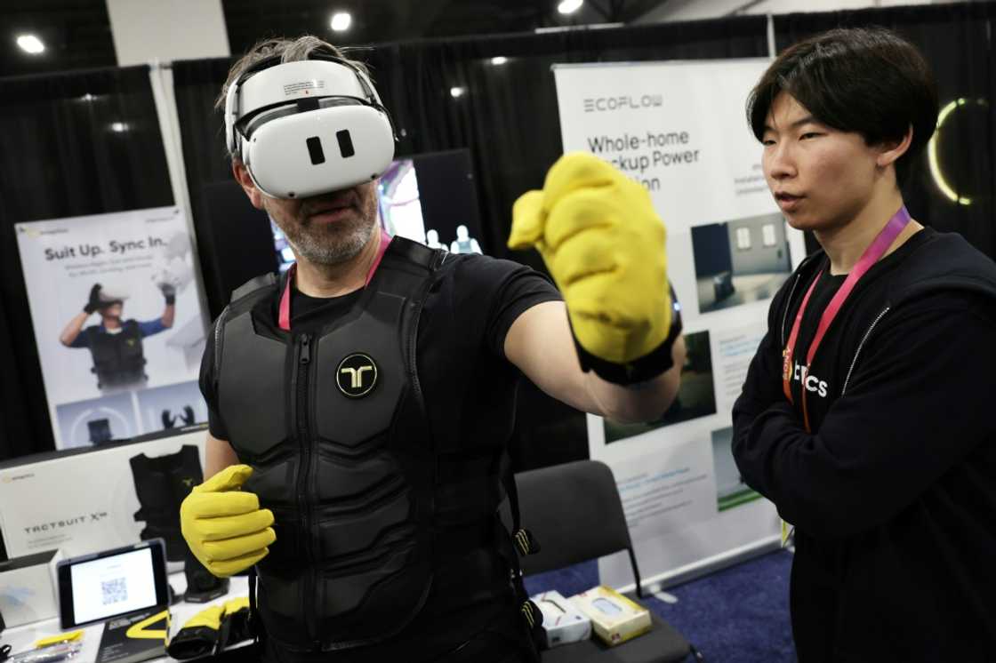 A man tries out the Haptic Suit by bHaptics at the CES tech show in Las Vegas