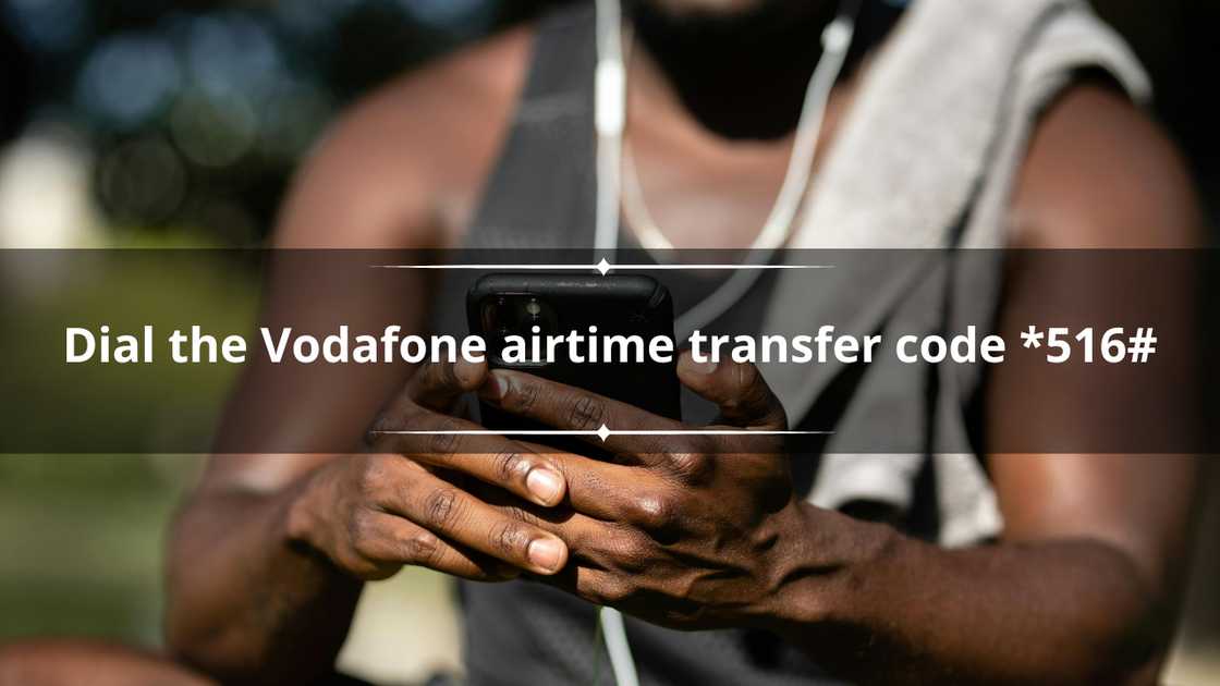 A man seated down scrolling on his phone A man seated down scrolling on his phone