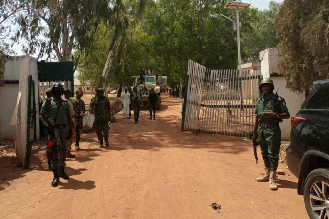 Nigerian soldiers and police guard the Federal College of Forestry Mechanisation in Kaduna state where a gang kidnapped 30 students in March, 2021