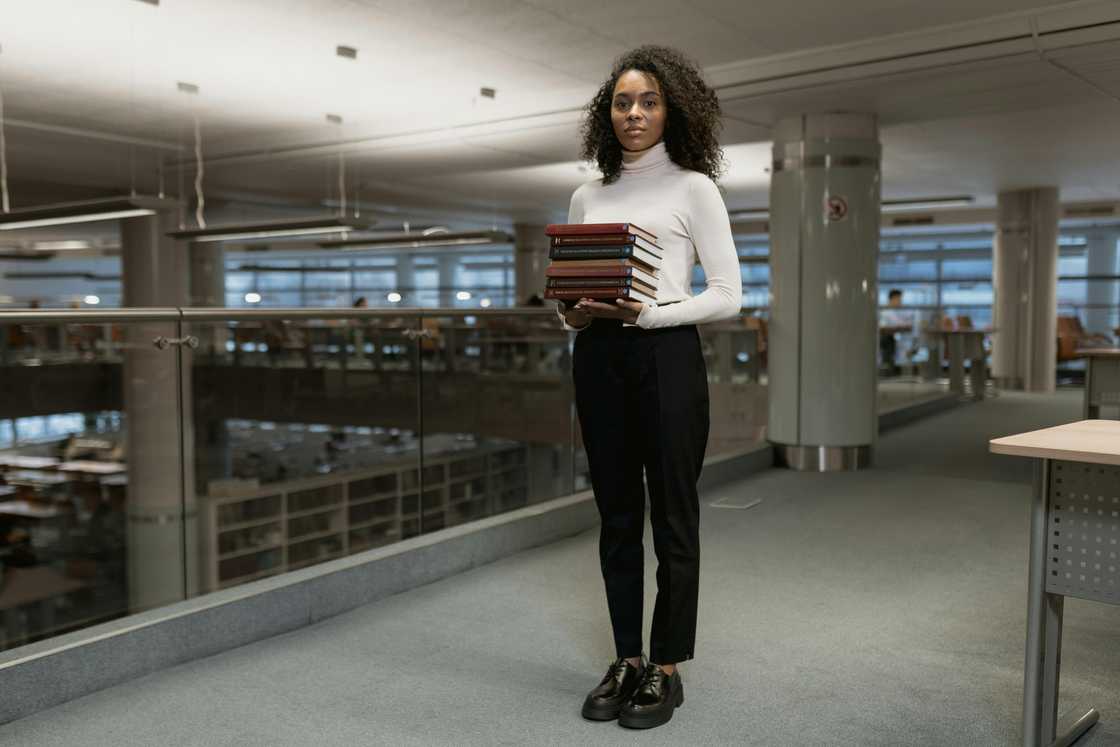 A student holding books