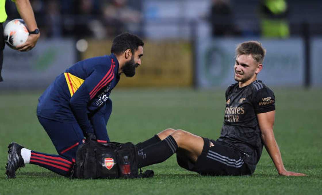 Arsenal Youth Physio Zubair Haleem assess Billy Vigar of Arsenal injury during the pre season friendly between Bromley and Arsenal U21 at Hayes Lane on July 26, 2022 in Bromley, England. Arsenal Youth Physio Zubair Haleem assess Billy Vigar of Arsenal injury during the pre season friendly between Bromley and Arsenal U21 at Hayes Lane on July 26, 2022 in Bromley, England.