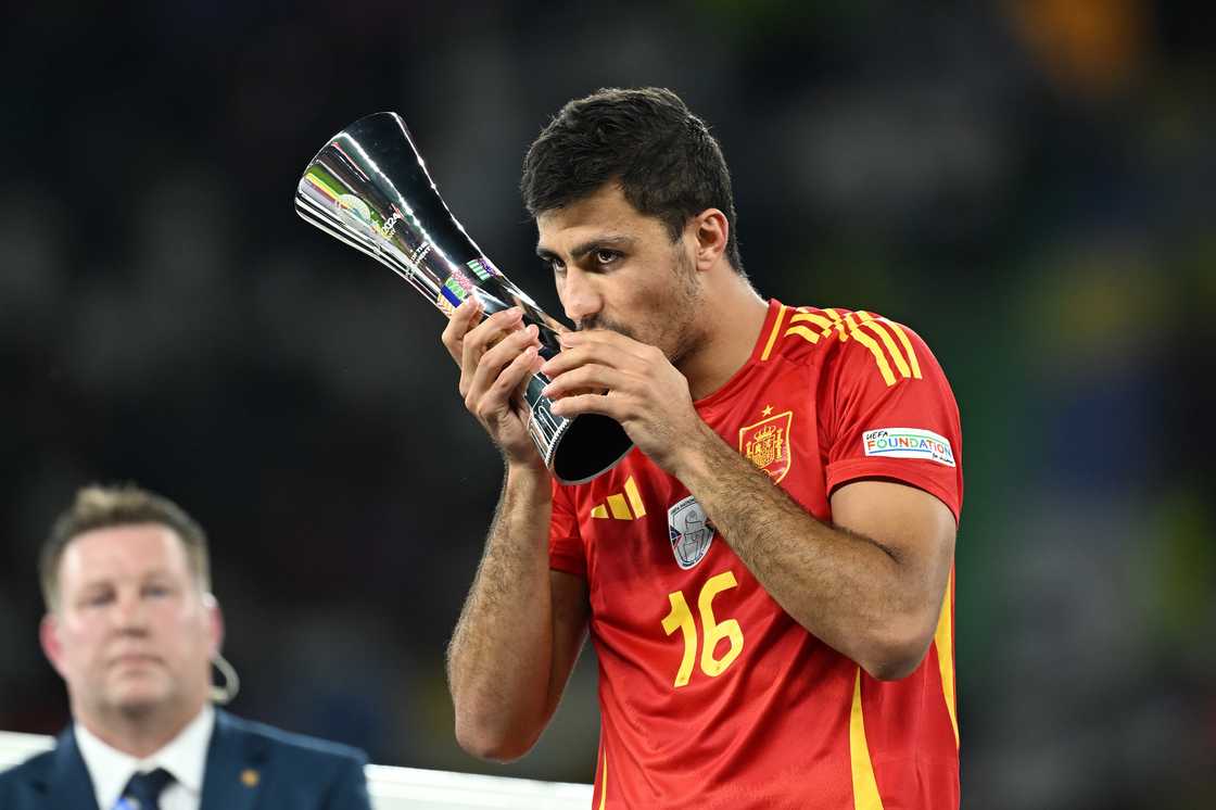 Rodri celebrates after winning MVP award at Euro 2024.