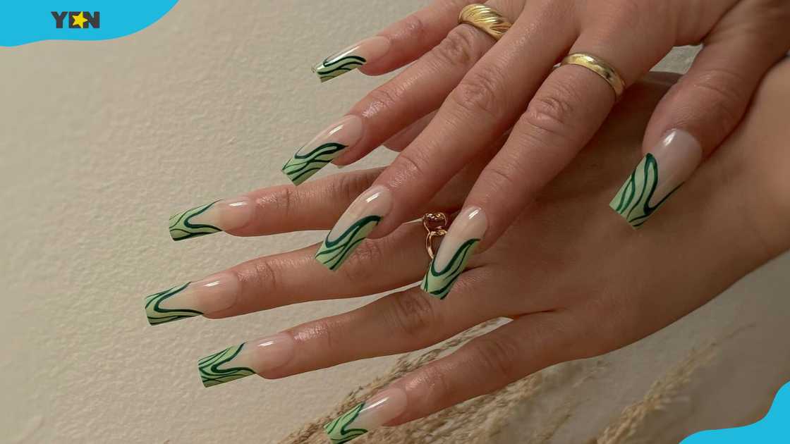 Modern green French tips with abstract lines Modern green French tips with abstract lines
