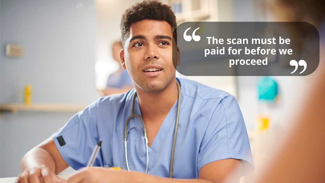 A junior nurse talking to a patient A junior nurse talking to a patient