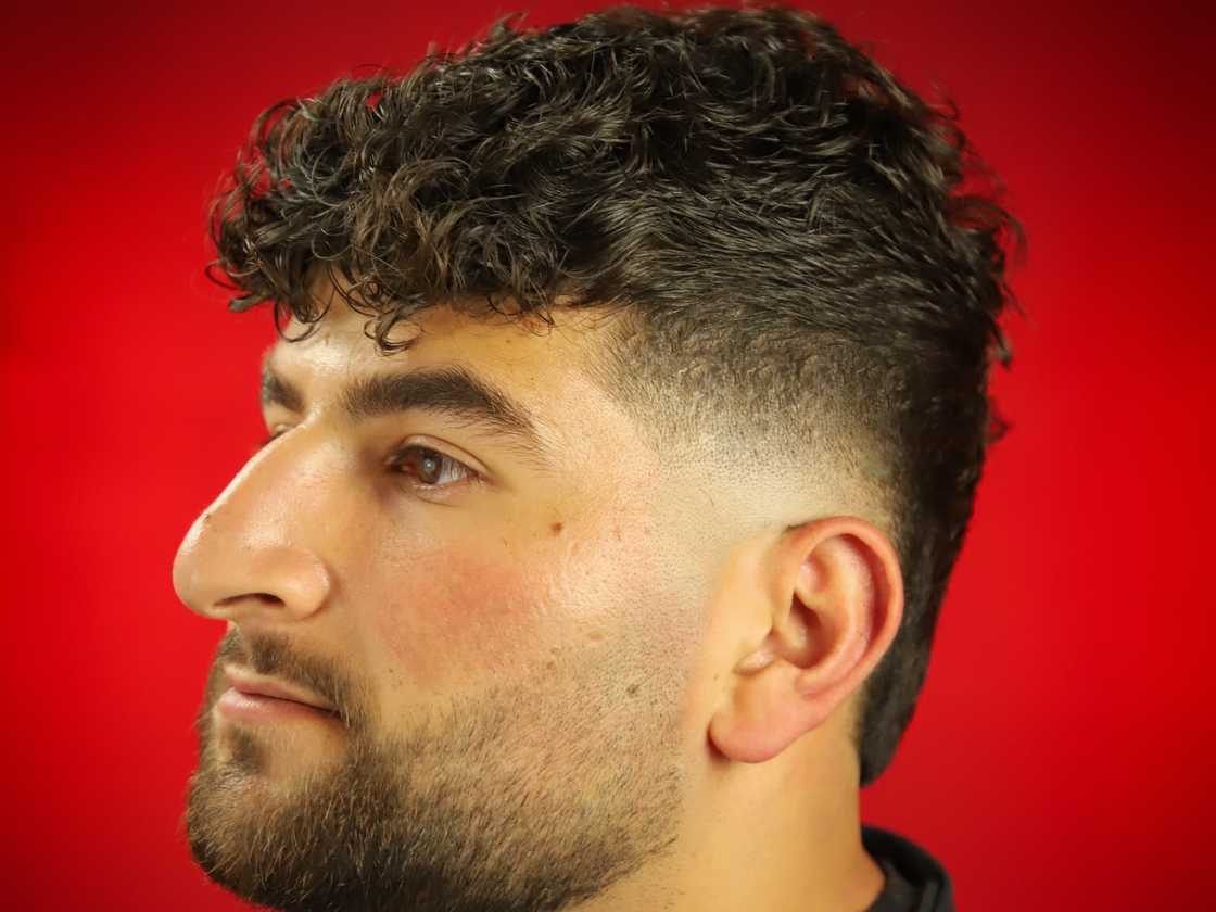 Textured curls with fade cut