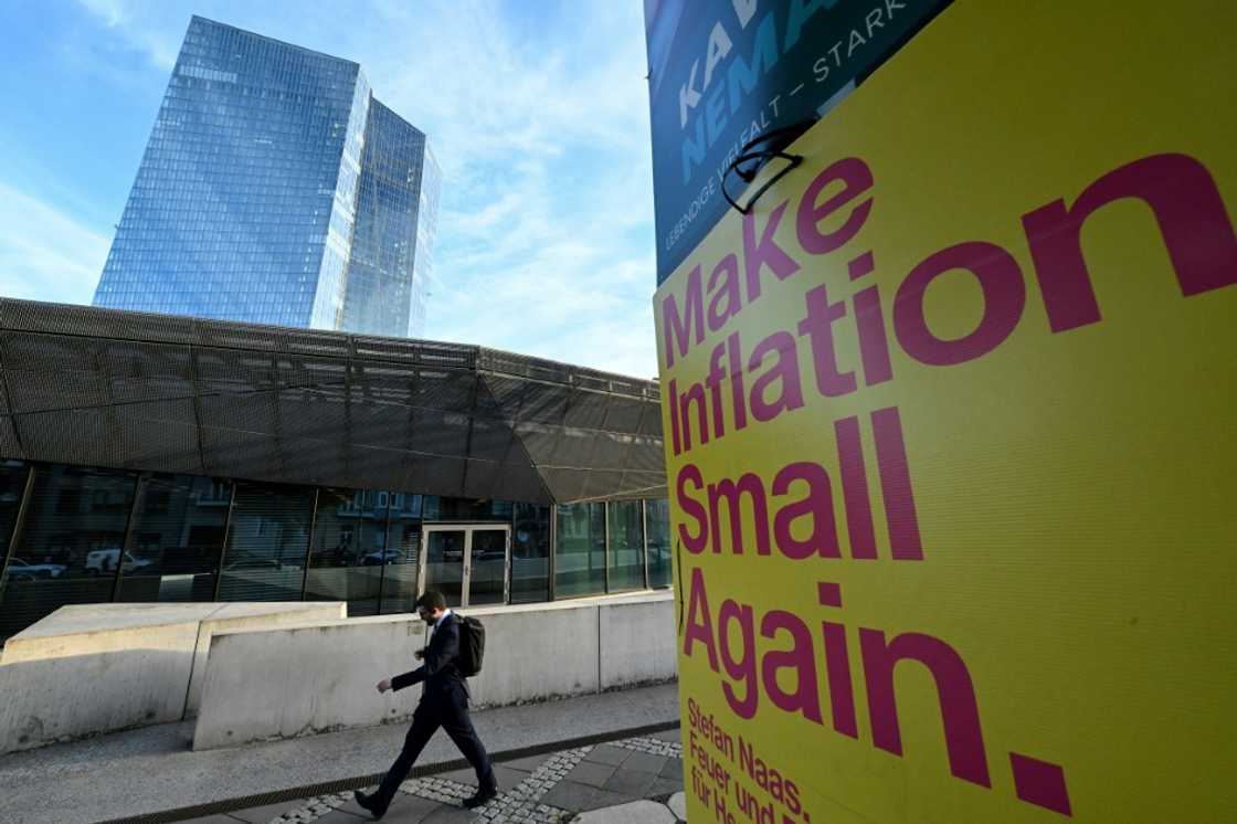 A banner reads "Make Inflation Small Again" next to the European Central Bank building in Frankfurt A banner reads "Make Inflation Small Again" next to the European Central Bank building in Frankfurt