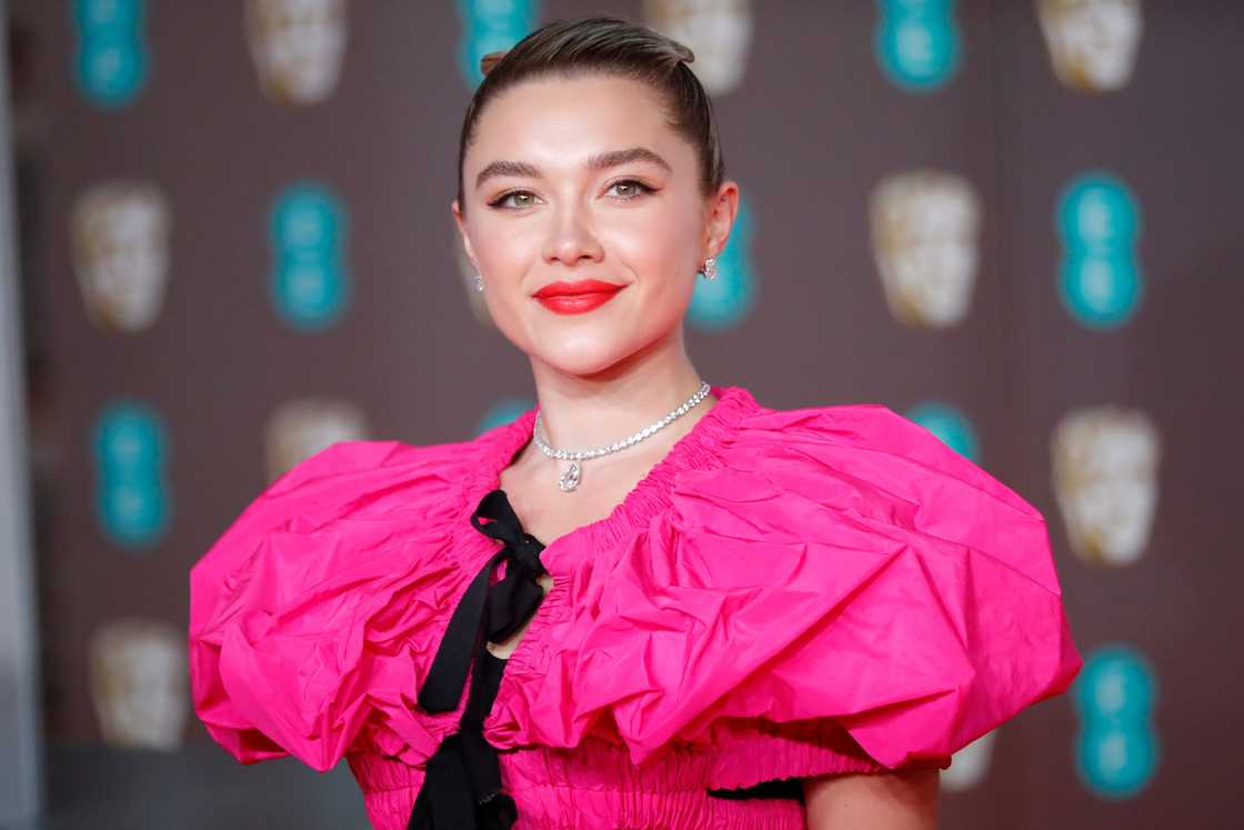 British actress Florence Pugh poses on the red carpet upon arrival at the BAFTA British Academy Film Awards at the Royal Albert Hall in London. Photo: Tolga AKMEN