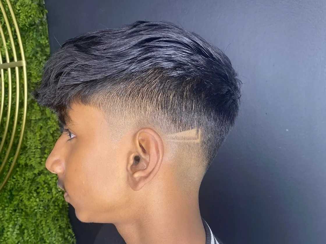 A boy with a brushed foward fringe A boy with a brushed foward fringe