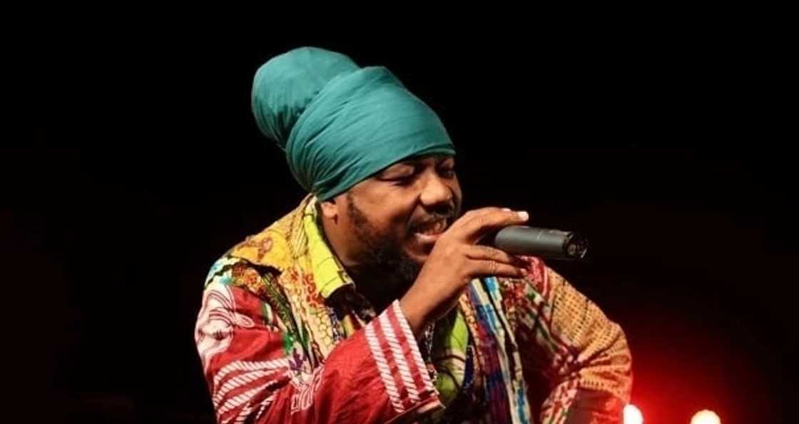 A man holding a microphone A man holding a microphone