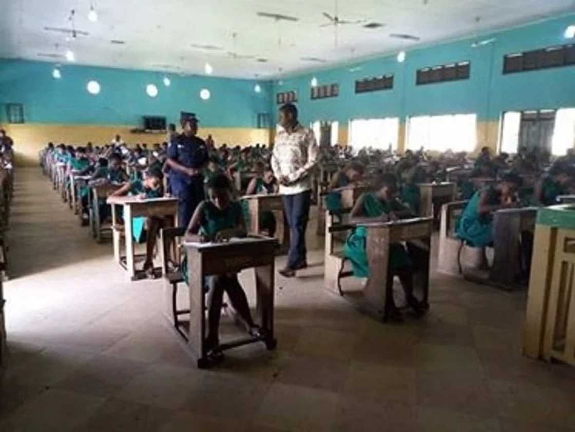 A group of students seated in a classroom A group of students seated in a classroom