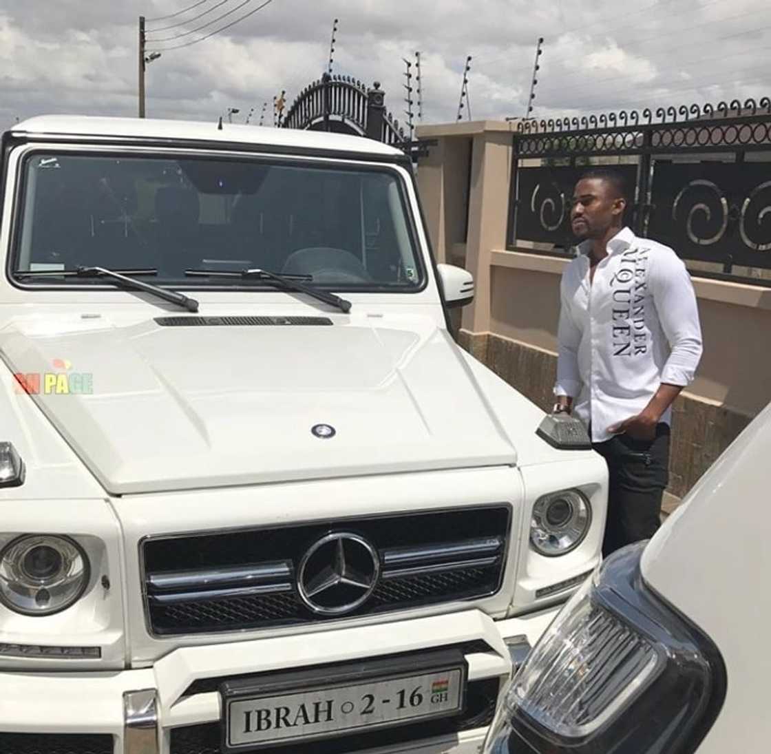 Ibrah and one of his many cars Ibrah and one of his many cars