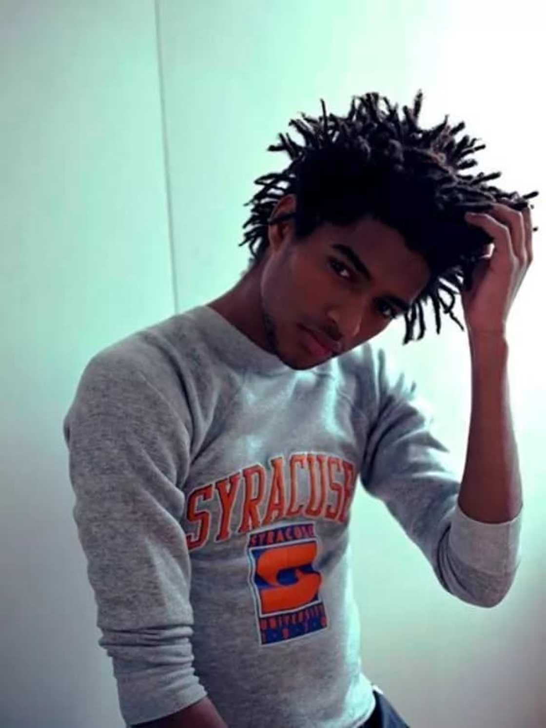 A man wearing dreadlocks A man wearing dreadlocks