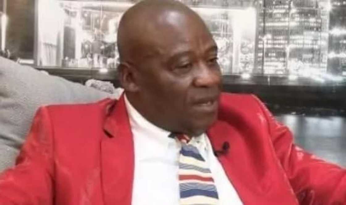 A man wearing a red coat A man wearing a red coat