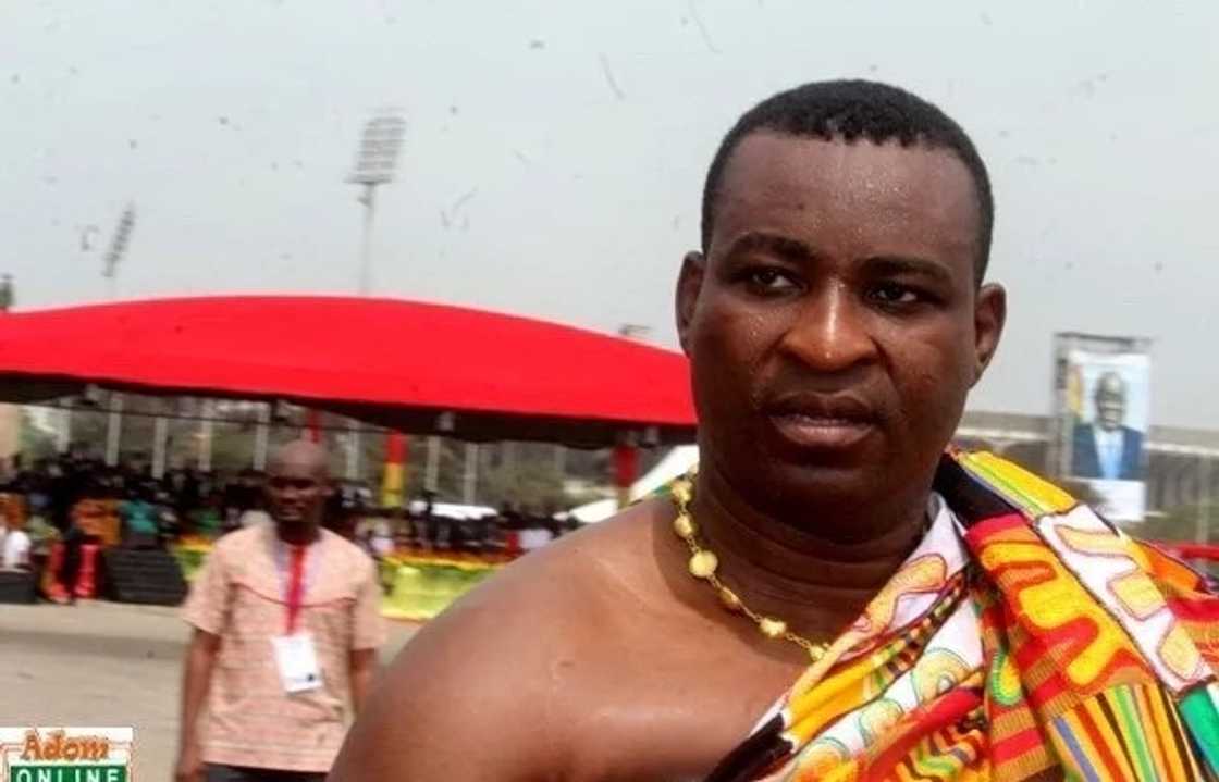 A man wearing a Kente cloth