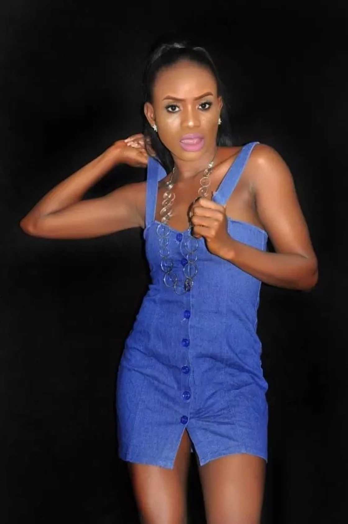 A woman posing for a photo A woman posing for a photo