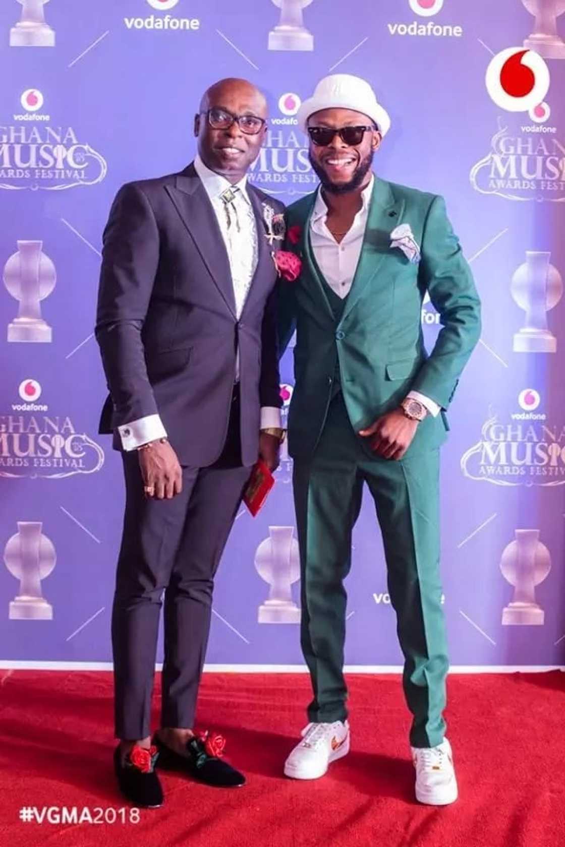 Two men posing for a photo Two men posing for a photo