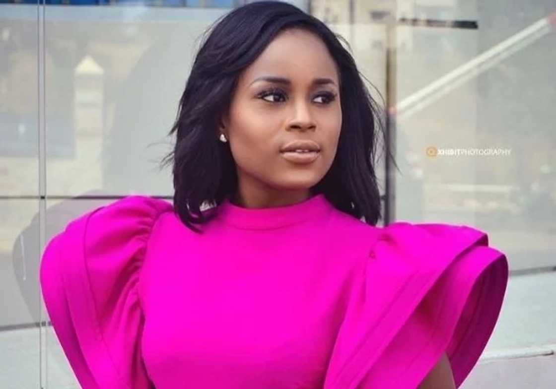 A woman wearing a pink dress A woman wearing a pink dress