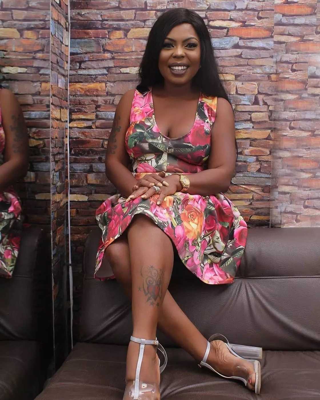 Afia Schwarzenegger sits down wearing a flower-patterned dress Afia Schwarzenegger sits down wearing a flower-patterned dress
