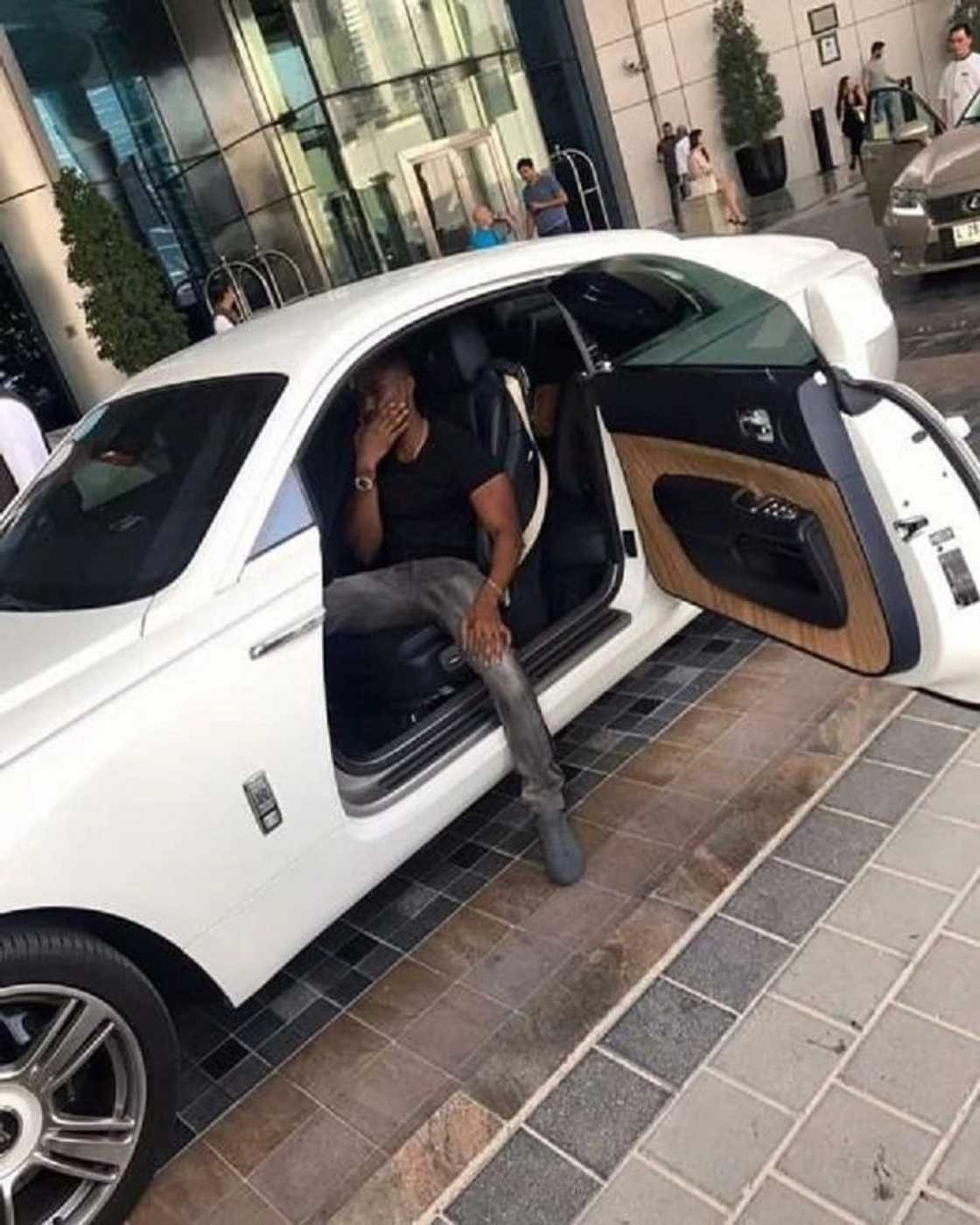 A man seated in a car