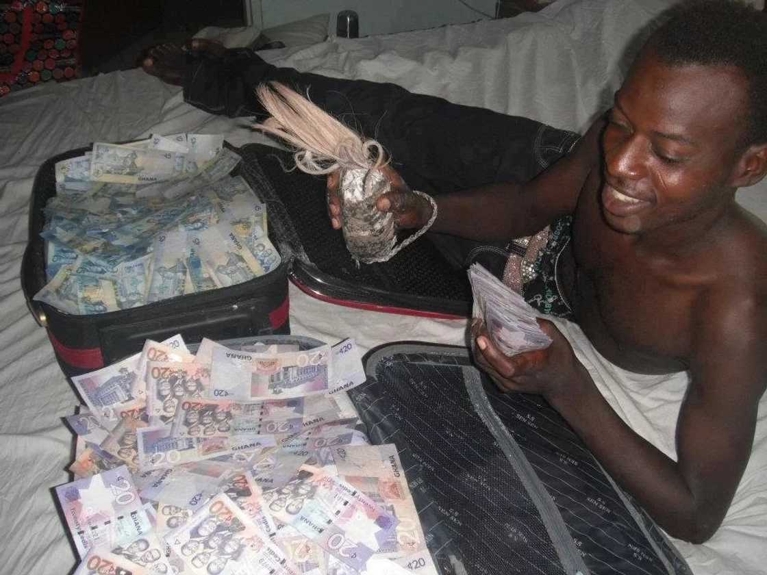 A boy with "sakawa" money / File Photo