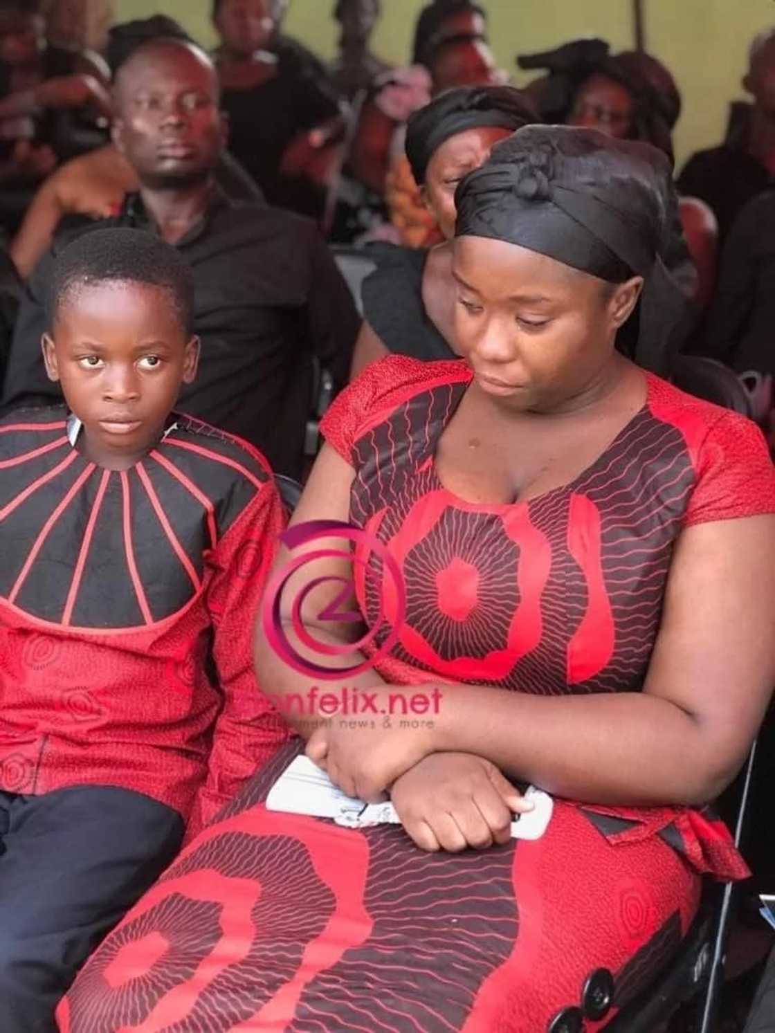 Actress Maame Serwaa in a somber state sitting next to her younger brother Actress Maame Serwaa in a somber state sitting next to her younger brother