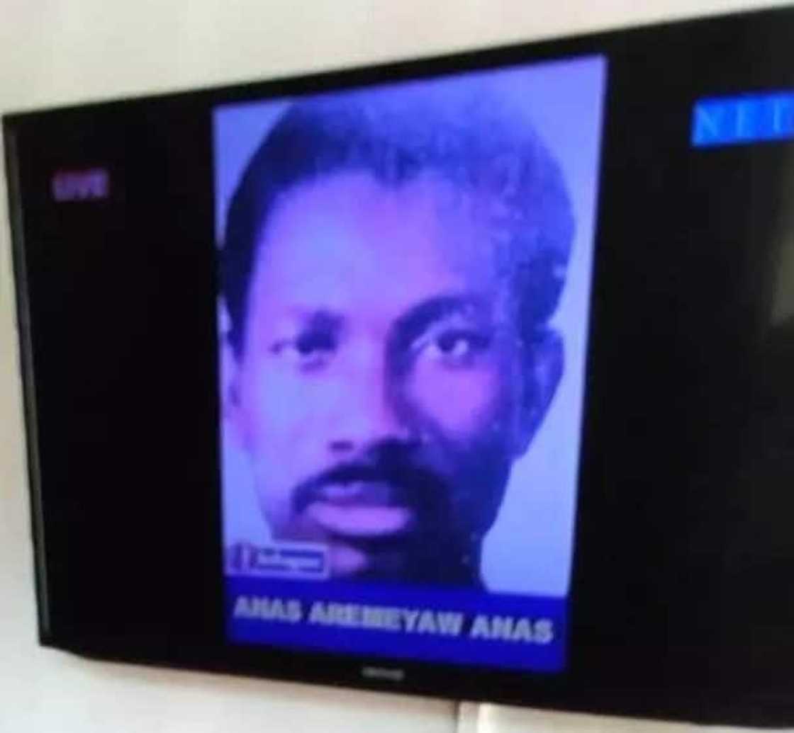 A face of a man on a TV screen A face of a man on a TV screen