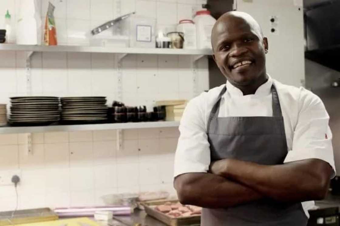 A chef with him arms folded