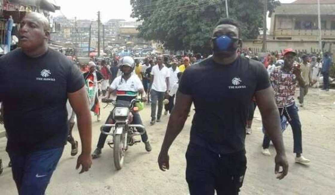 A group of people walking A group of people walking