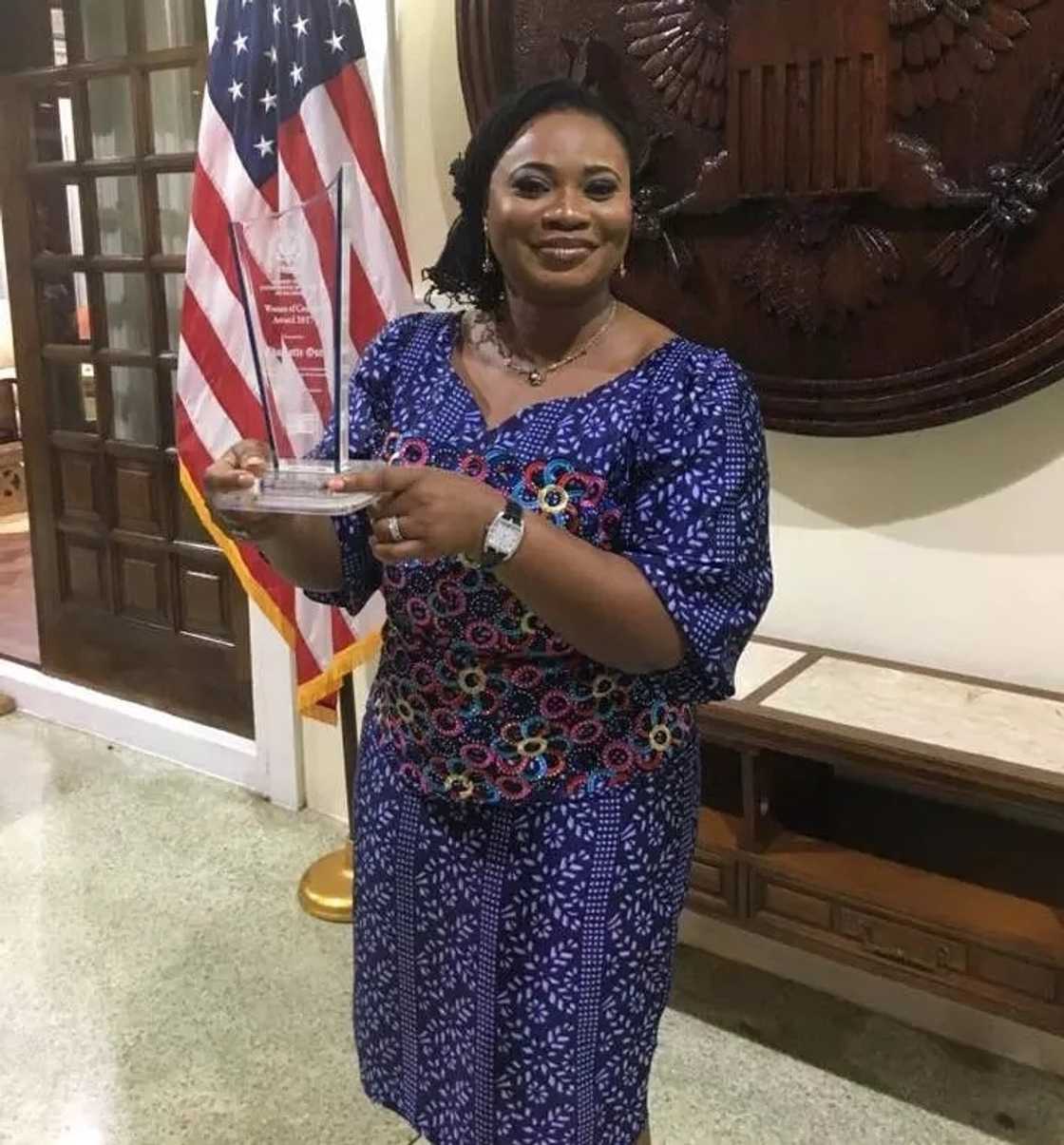 Charlotte Osei with her "Women of Courage" award Charlotte Osei with her "Women of Courage" award