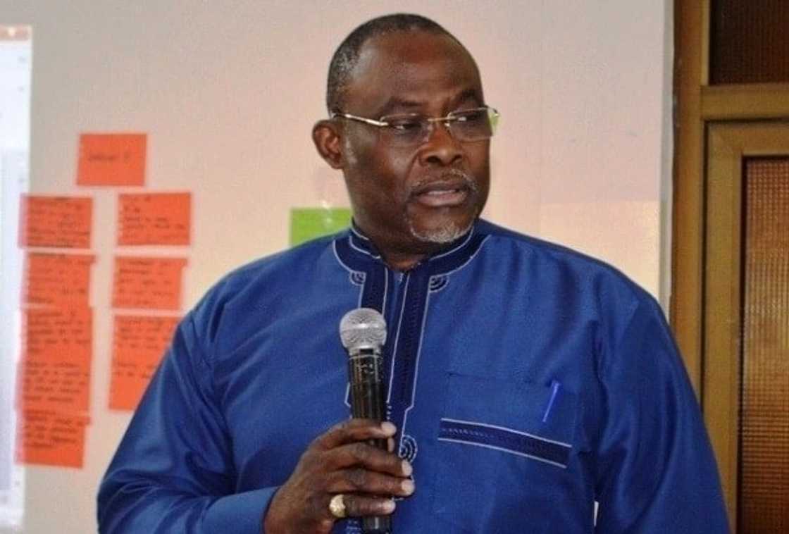 A man holding a microphone A man holding a microphone