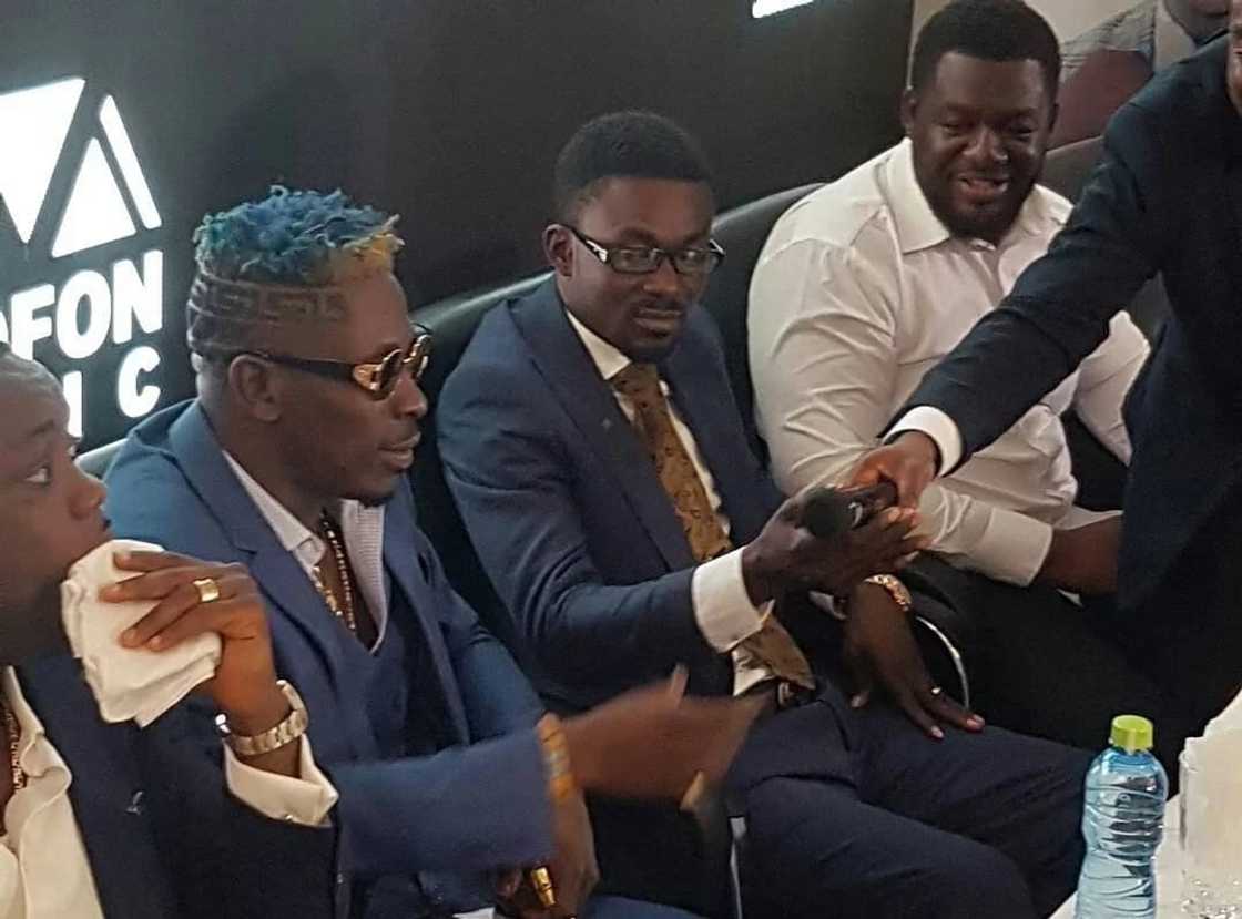 Shatta Wale sits with Zylofon boss, Nana Appiah Mensah and Bulldog (in white) at the unveiling ceremony on Wednesday Shatta Wale sits with Zylofon boss, Nana Appiah Mensah and Bulldog (in white) at the unveiling ceremony on Wednesday