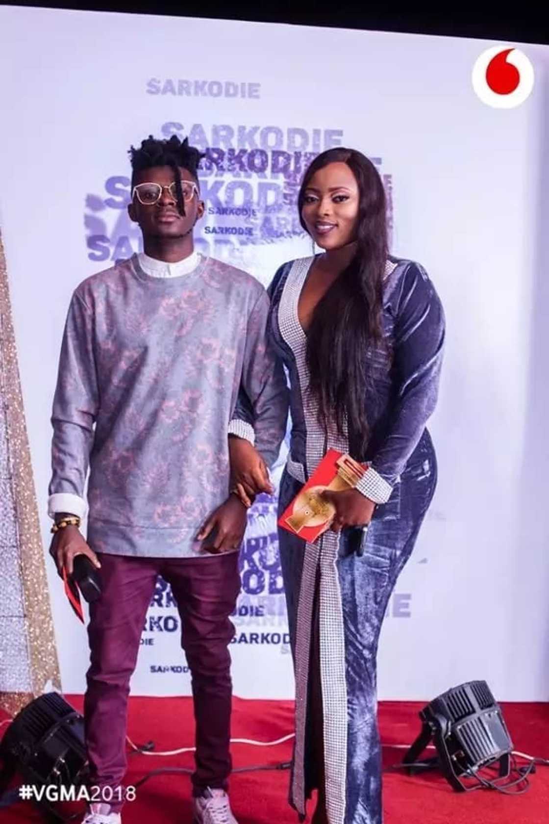 Two people posing for the camera Two people posing for the camera