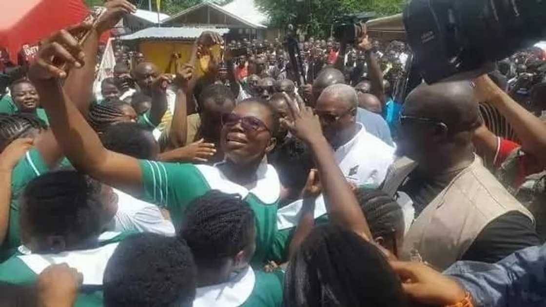 A group of people gathered in a school A group of people gathered in a school