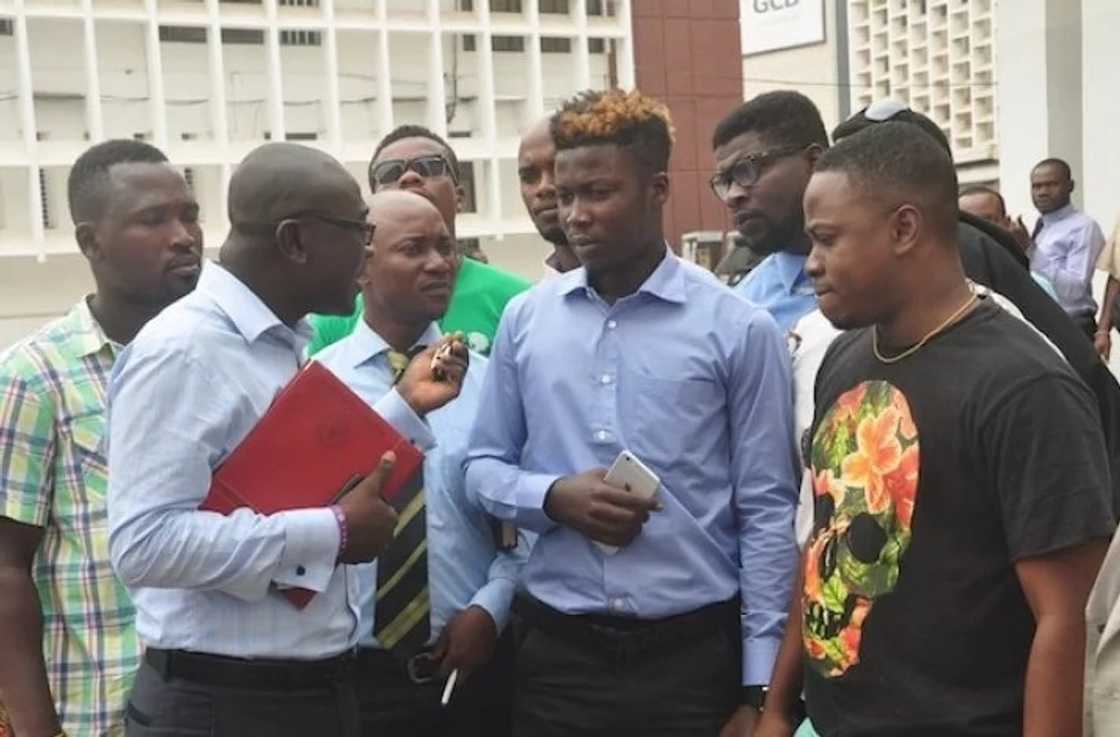 Wisa Greid stands with his legal counsel and friends