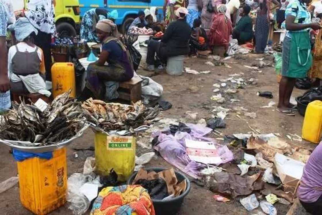 Traders surrounded by filth
