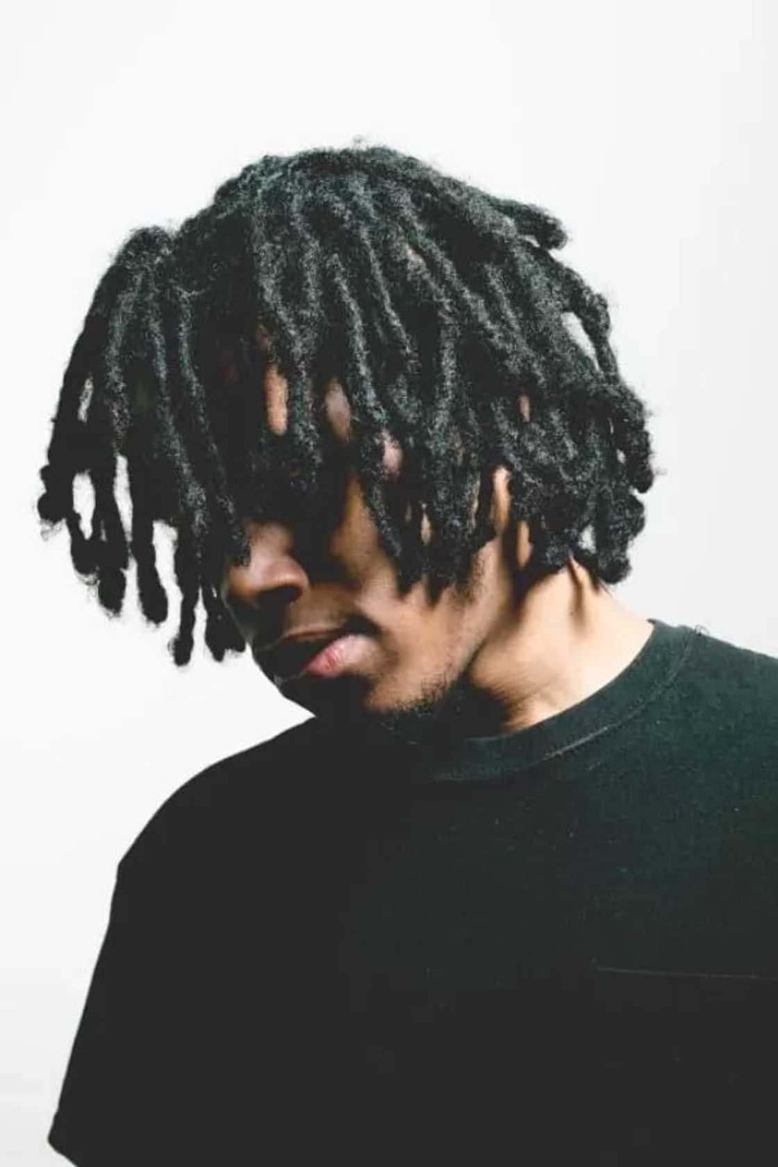 A man wearing dreadlocks A man wearing dreadlocks