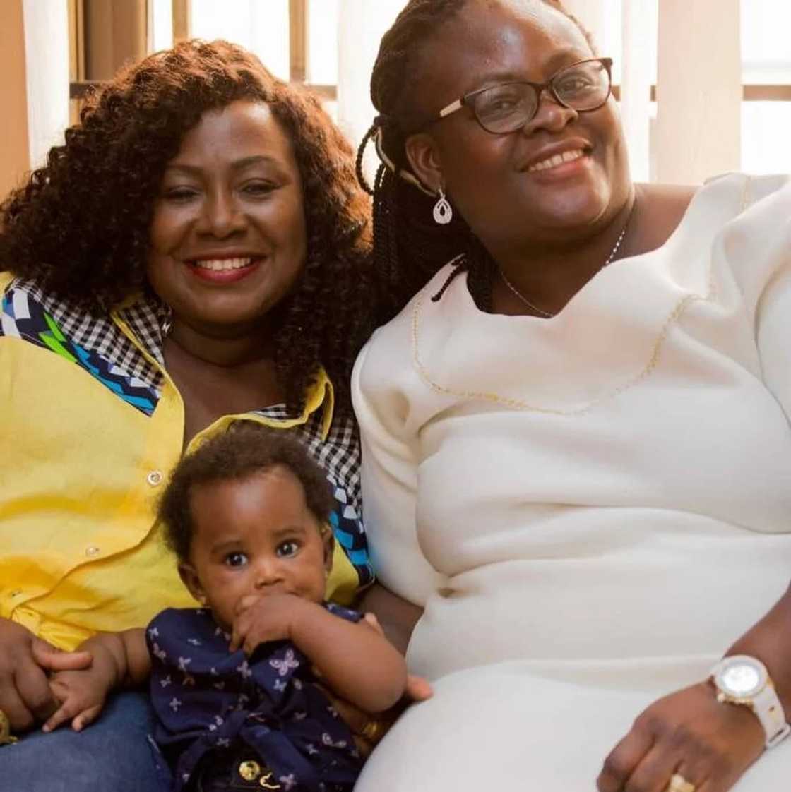 Gifty Anti, her baby and a relative Gifty Anti, her baby and a relative
