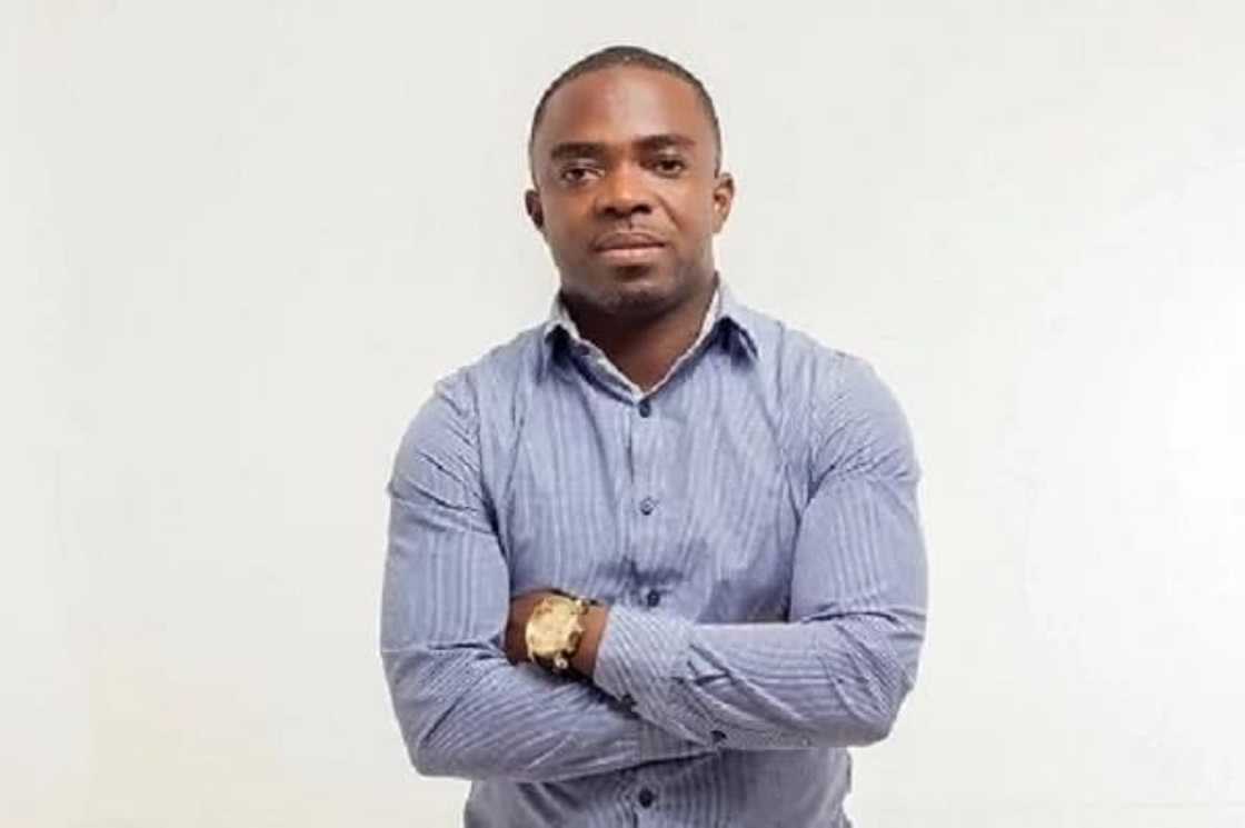 A man with his arms folded A man with his arms folded