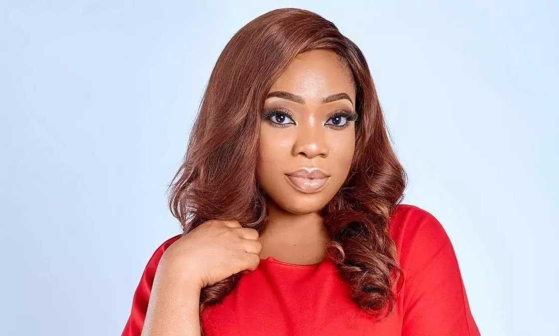 Moesha Boduong wearing a red dress